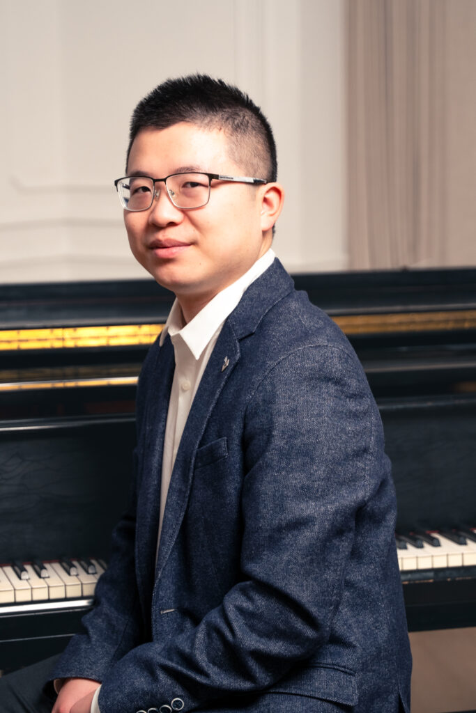Jack Zhao, Toronto piano teacher, seated at the piano